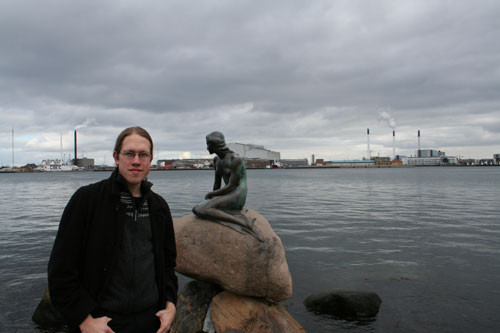 Me in front of the The Little Mermaid statue (and some industry in the back)